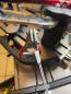 Preview: Professional starting clamp in use with extension cable on a stringing machine