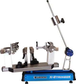 Gamma X-6 FC Pro tabletop stringing machine in full view with drop-weight arm, 6-point mounting system and fixed clamps